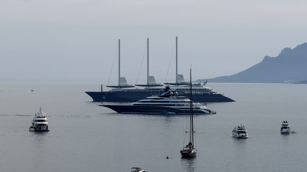 Sailing ships and superyachts at anchor in the bay of Cannes